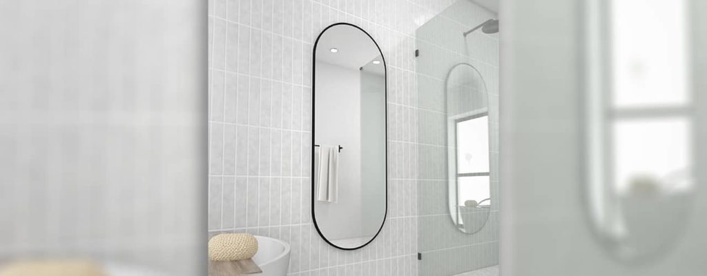 Wayfair Pill or Oval shaped mirror with black frame. Great for cheap bathroom makeovers. 