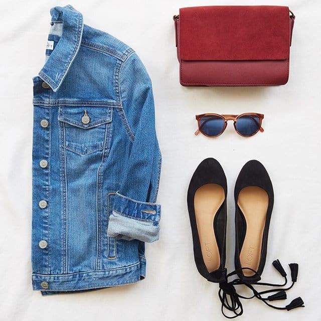 Ann Taylor Loft Basics that make a really cute outfit. The setup includes a rolled sleeve jean jacket, black flats with wrap-around ankle tassles, a pair of tortoise shell sunglasses and a red messenger bag style purse.